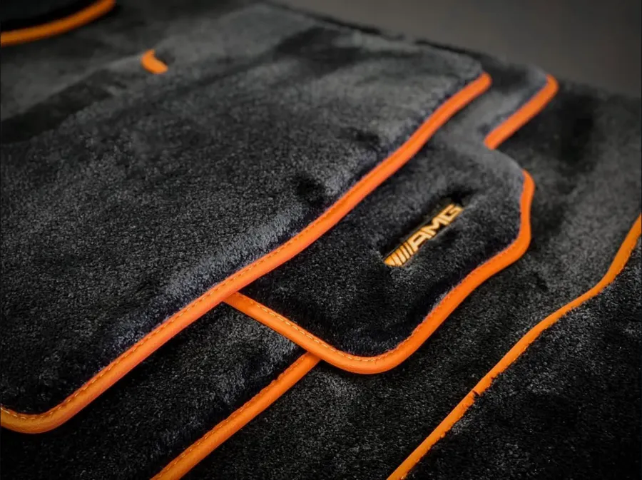 Mercedes-AMG — black pile, orange leather edging, embroidery